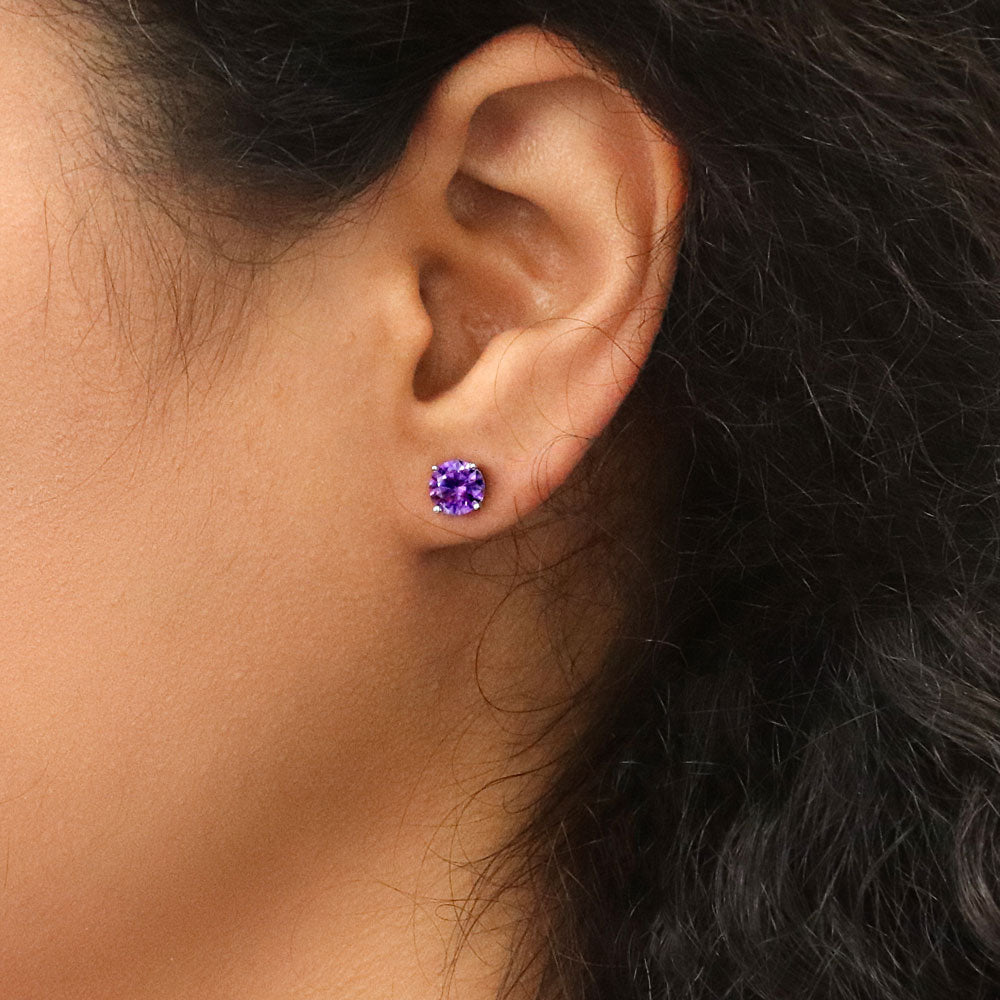 Model wearing Solitaire 1.6ct CZ Cartilage Stud Earrings in Sterling Silver, Amethyst Color