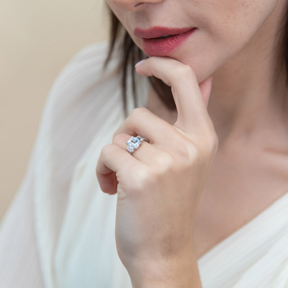 Model wearing 3-Stone 2.1ct Emerald Cut CZ Ring in Sterling Silver, 7 of 9