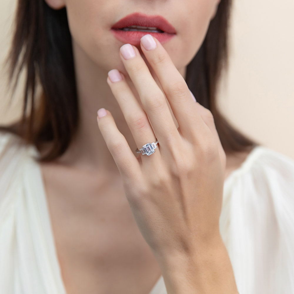 Model wearing 3-Stone 2.1ct Emerald Cut CZ Ring in Sterling Silver, 6 of 9