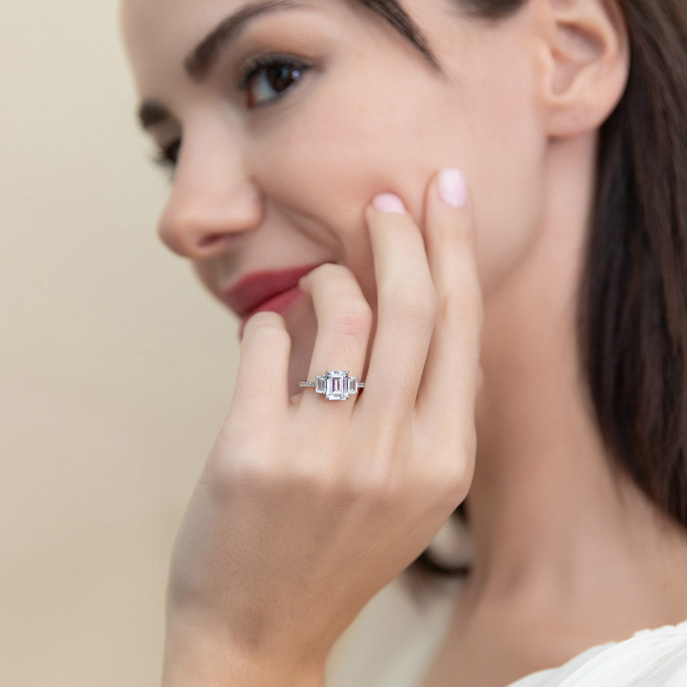 Model wearing 3-Stone 2.1ct Emerald Cut CZ Ring in Sterling Silver, 2 of 9