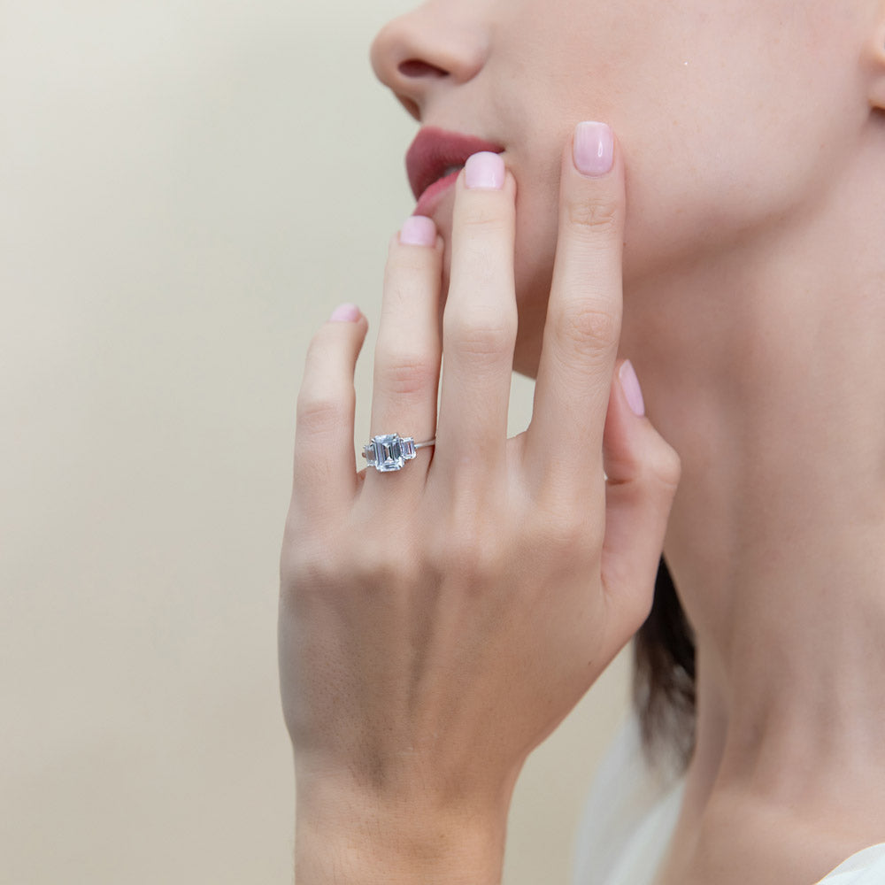 Model wearing 3-Stone 2.1ct Emerald Cut CZ Ring in Sterling Silver, 2 of 8
