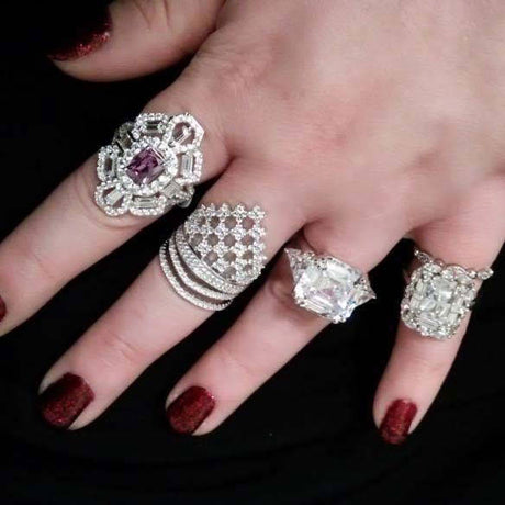 Model Wearing 3-Stone Ring, Bubble Eternity Ring, Checkerboard Ring, Halo Ring, Navette Ring