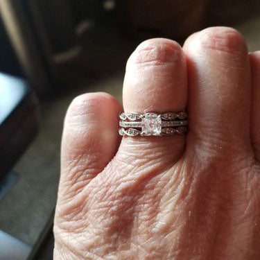 Model Wearing Solitaire with Side Stones Ring, Woven Eternity Ring