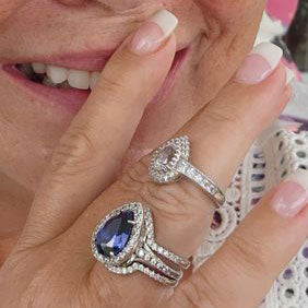 Image Contain: Model Wearing Dome Curved Half Eternity Ring, Halo Ring, Wishbone Curved Half Eternity Ring