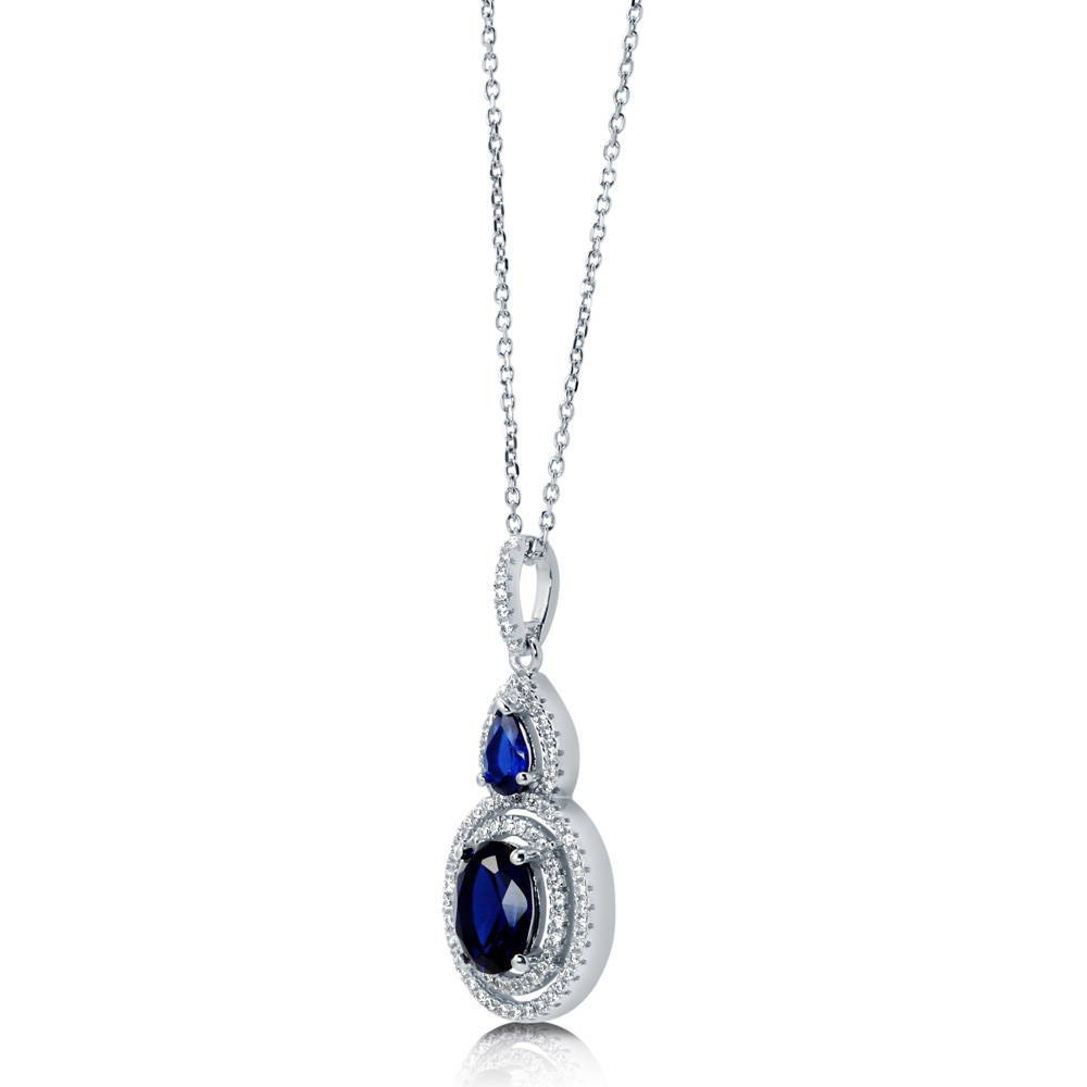 Angle view of Halo Sapphire-Blue Oval CZ Necklace in Sterling Silver, 5 of 6